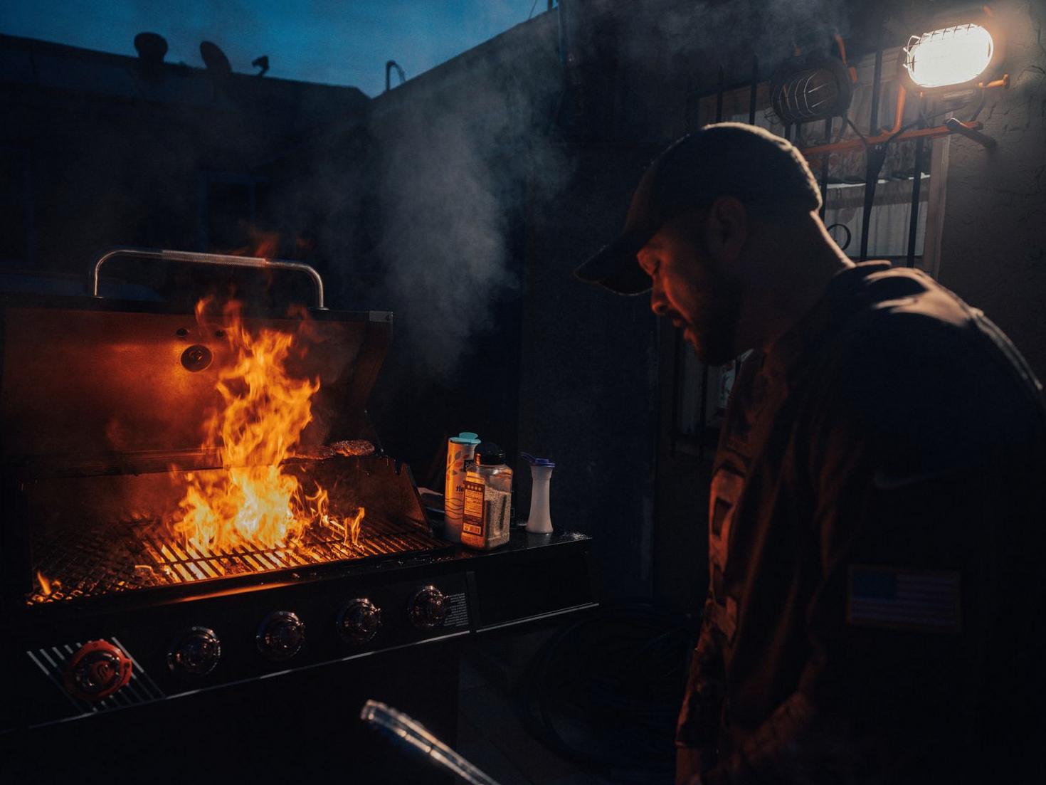 Live fire BBQ cooking with smoke and flames