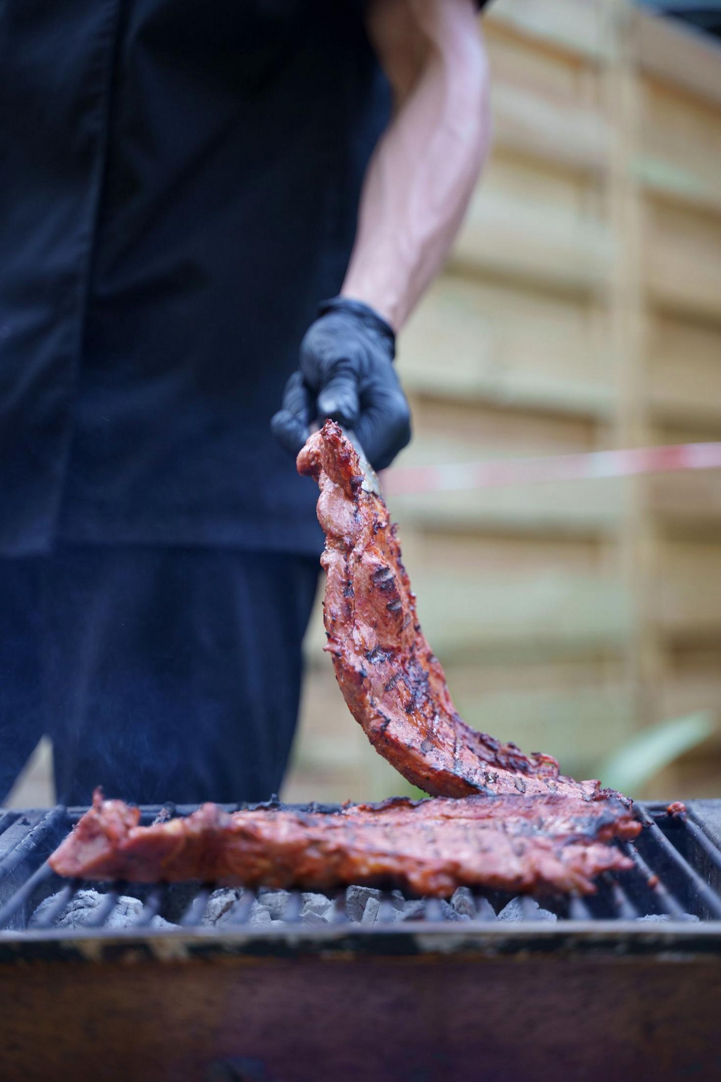 Succulent ribs cooking on an outdoor grill