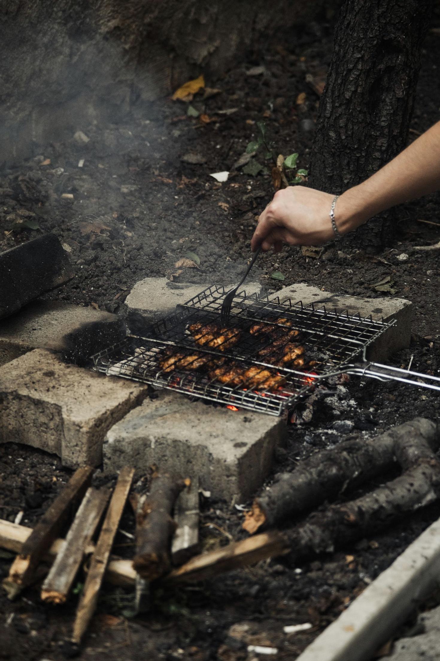 Pitmaster preparing the grill