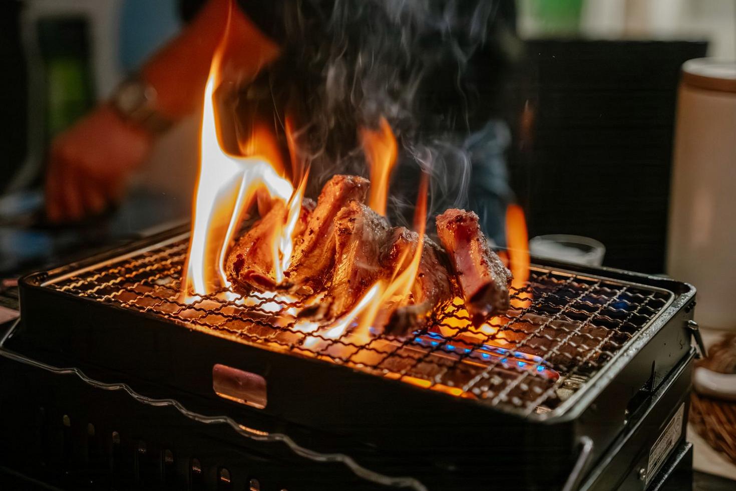 Live fire cooking with smoke and flames